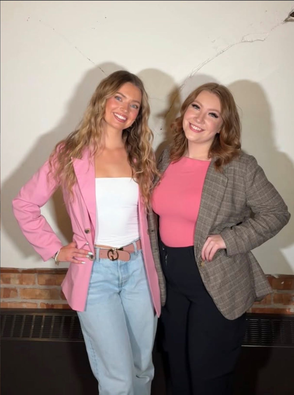 Hannah of Bold & Boozy and a makeup artist she worked an event with, both smiling in blazers