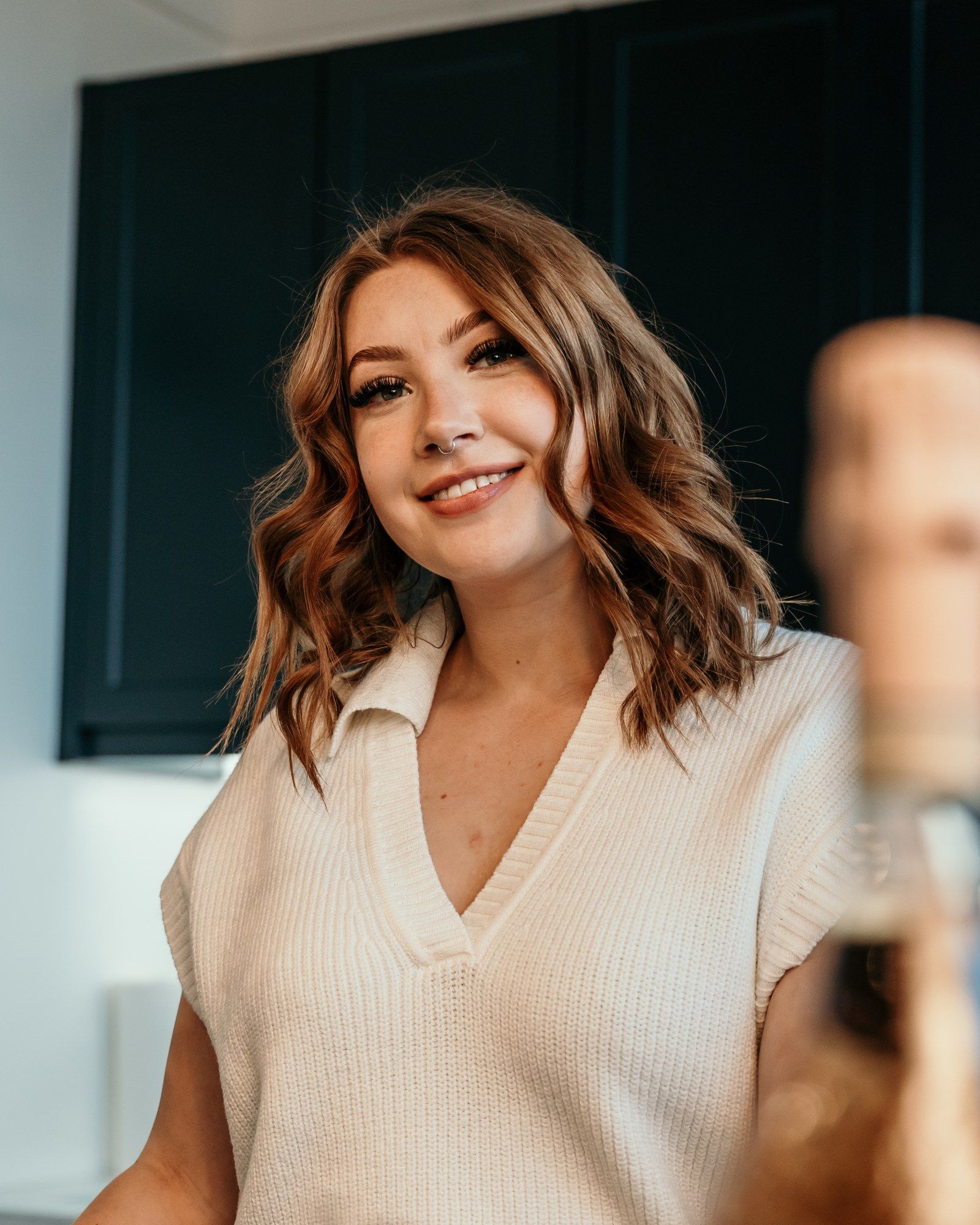 Hannah smiling behind the bar